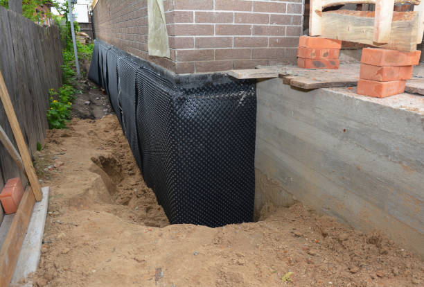 SJ Waterproofing Pros technician performing targeted Basement Waterproofing assessment in South Whitley, IN